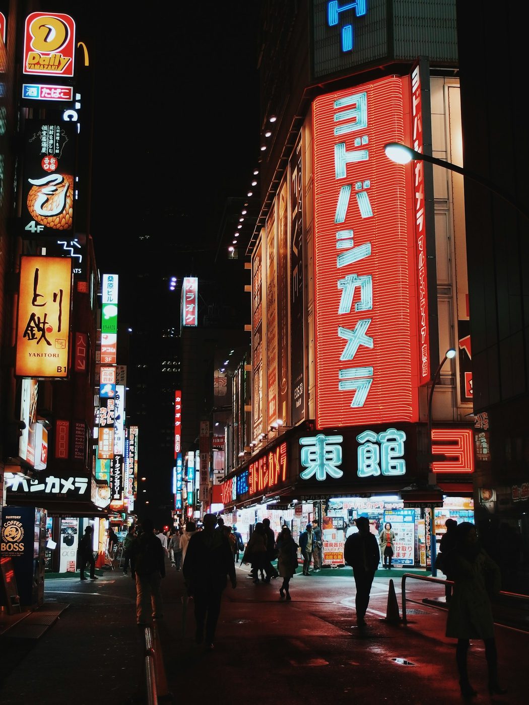 People in a lively city street environment, representing NLOM's Out of Home & Cinema channel