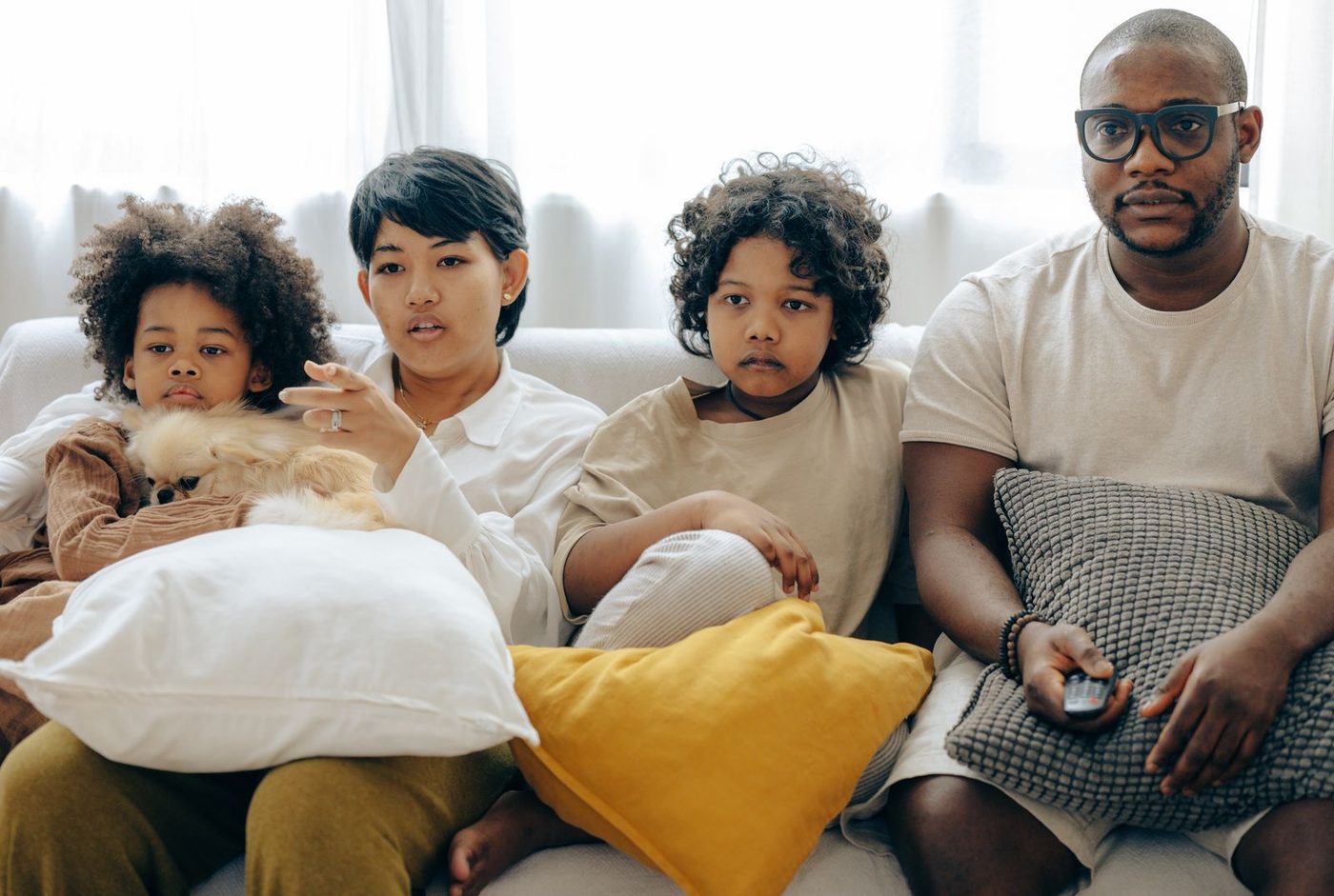 Family watching television together at home, representing NLOM's Television & BVOD channel
