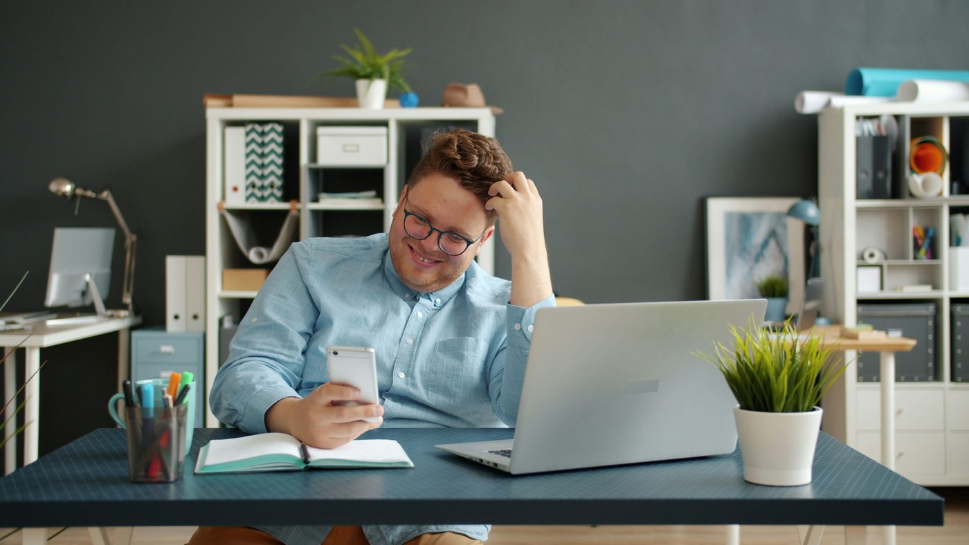 Person absorbed watching online video content, representing NLOM's YouTube & Online Video channel